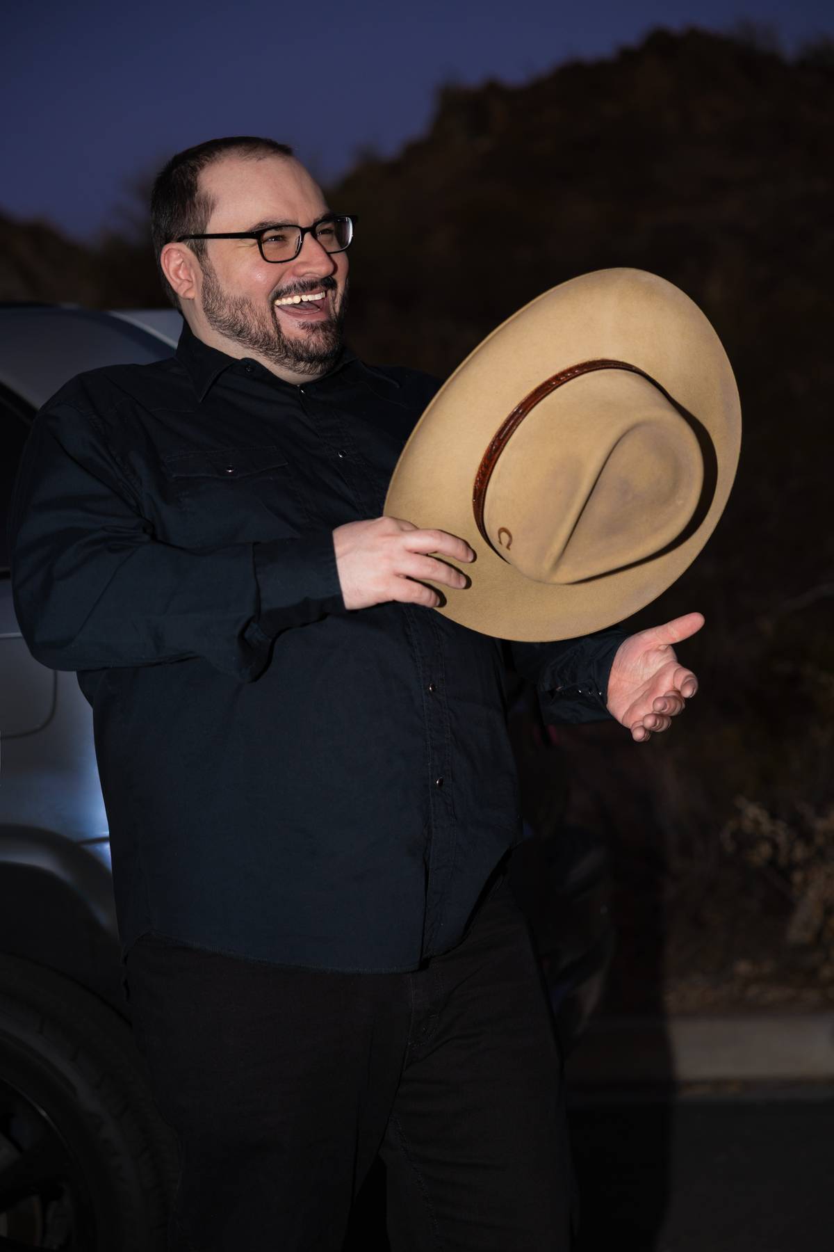 Robert Adams laughing in a hat