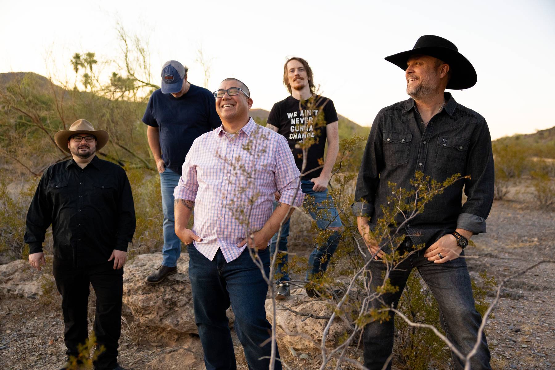 Band in the desert laughing