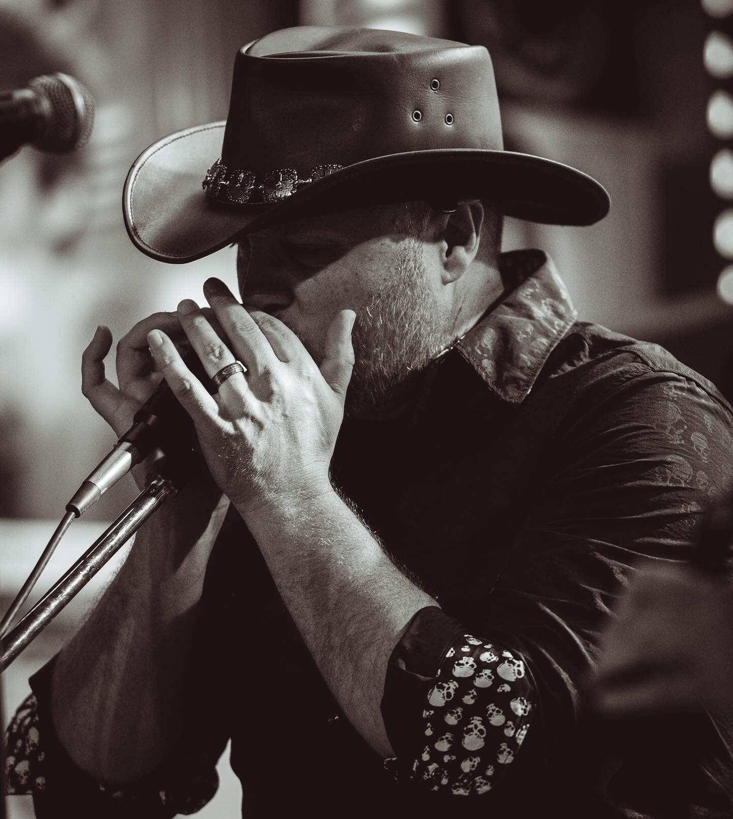Brian Owens playing harmonica